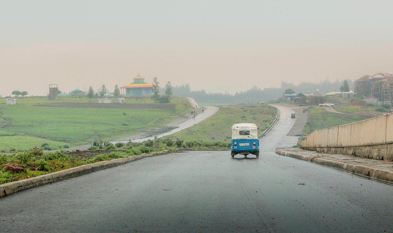 tricycle, road, hills, wet road, street, lane, pavement, avenue, vehicle, transportation, addis ababa, ethiopia, orthodox church, africa, rain, rainy, rainy weather, landscape, nature, fields, addis ababa, addis ababa, addis ababa, ethiopia, ethiopia, ethiopia, ethiopia, ethiopia